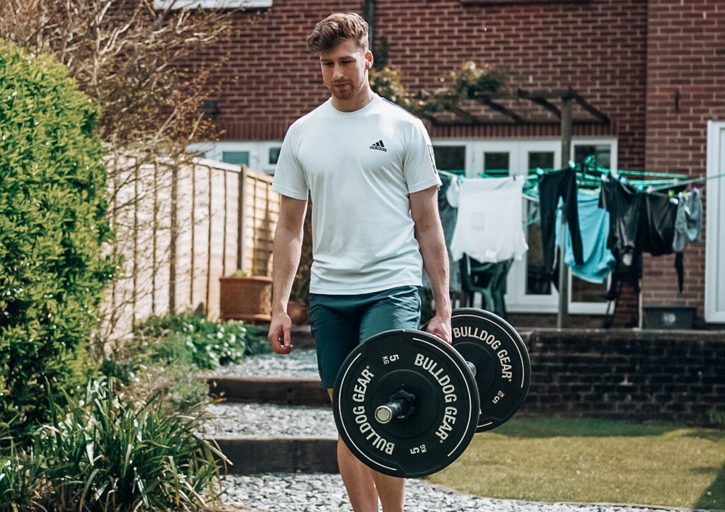 Farmer's carries with a barbell