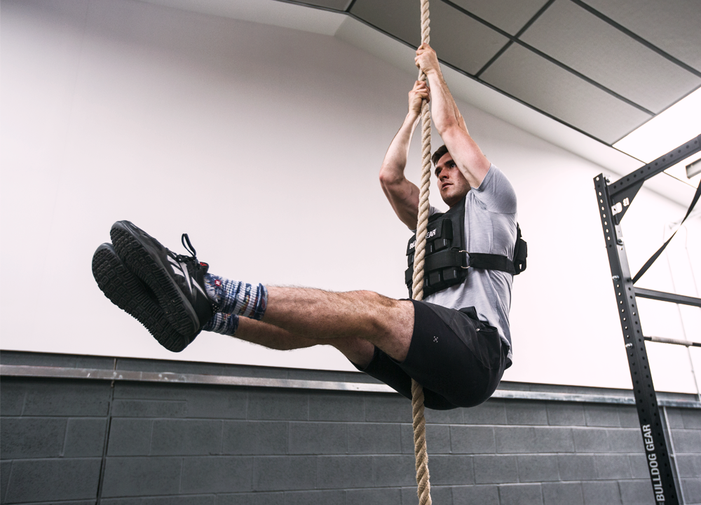 Weighted legless rope climb in a Bulldog Gear 20kg weight vest